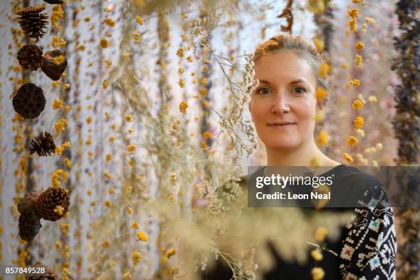 Artist Rebecca Louise Law poses with her new installation "Life in Death" at Kew Gardens on October 5, 2017 in London, England. The artwork,...