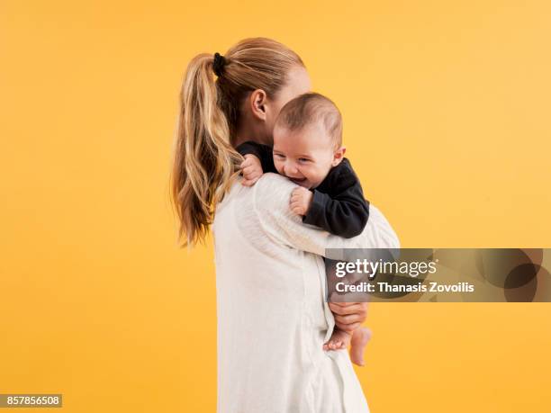 mother with her newborn son - baby studio bildbanksfoton och bilder