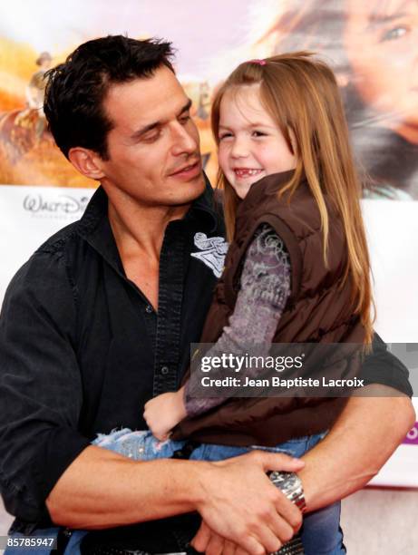 Antonio Sabato Jr. And daughter Mina arrive at the Los Angeles premiere of "Hannah Montana The Movie" at the El Capitan Theatre on April 2, 2009 in...