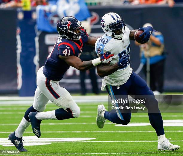 Delanie Walker of the Tennessee Titans is run down from behind by Zach Cunningham of the Houston Texans at NRG Stadium on October 1, 2017 in Houston,...