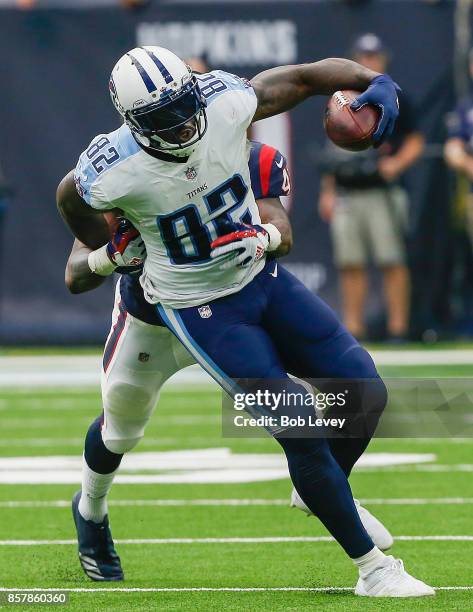 Delanie Walker of the Tennessee Titans is run down from behind by Zach Cunningham of the Houston Texans at NRG Stadium on October 1, 2017 in Houston,...