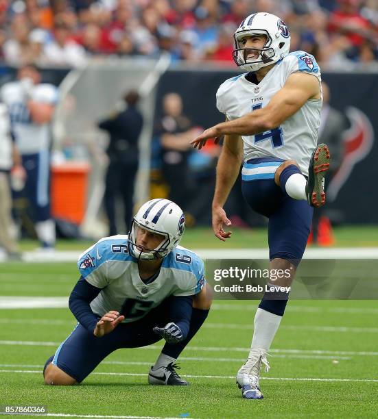 Ryan Succop of the Tennessee Titans makes the extra point out of the hold of Brett Kern during a game against the Houston Texans at NRG Stadium on...