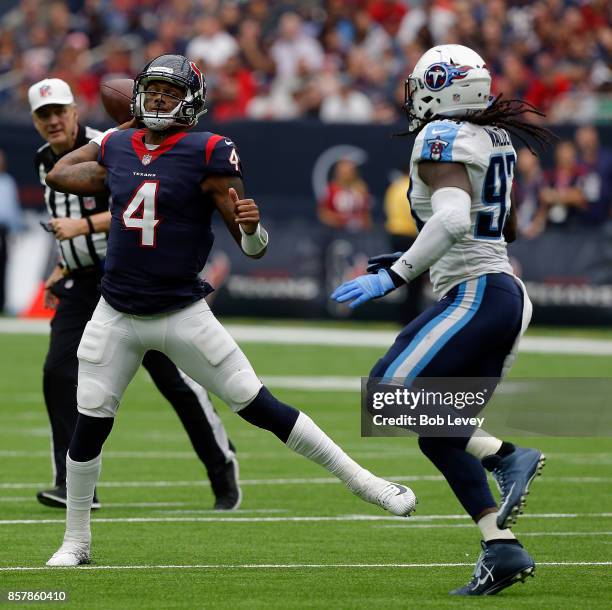 Deshaun Watson of the Houston Texans throws as he is pressured by Erik Walden of the Tennessee Titans at NRG Stadium on October 1, 2017 in Houston,...