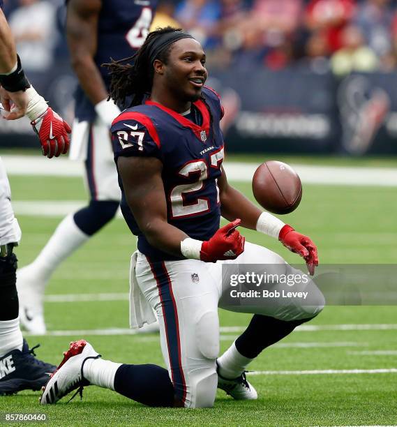 Onta Foreman of the Houston Texans runs with the ball against the Tennessee Titans at NRG Stadium on October 1, 2017 in Houston, Texas. Houston won...