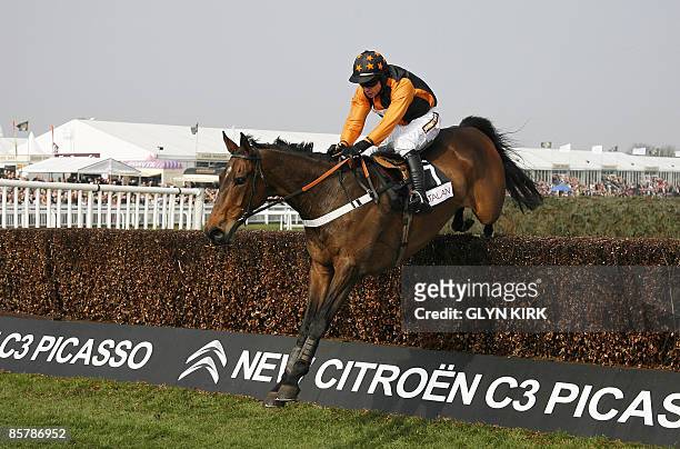 Denis O'Regan rides the horse' Killyglen' over the last hurdle to win The Mildmay Novices Steeple Chase during the second day of the Grand national...