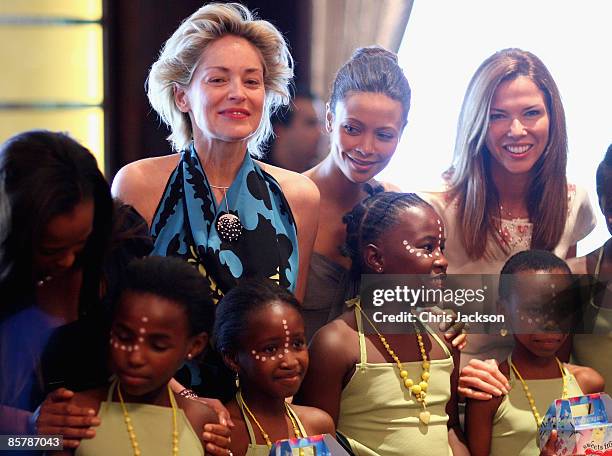 Sharon Stone, Thandie Newton and Heather Kerzner meet children after they performed during a lunch to Benefit the Mandela Children's Foundation as...