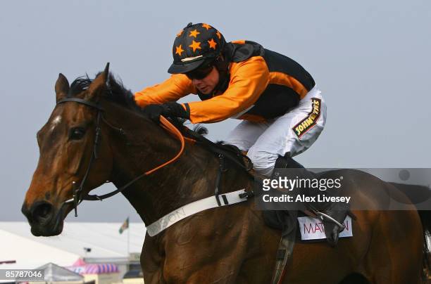 Killyglen ridden by Denis O'Regan clears the last fence on the way to victory in the matalan.co.uk Mildmay Novices' Steeple Chase at Aintree...