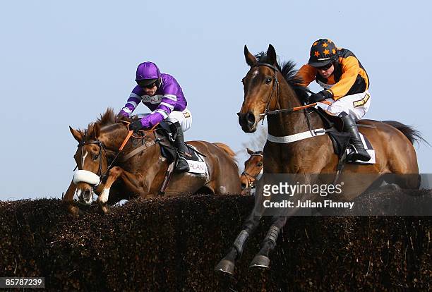 Killyglen ridden by Denis O'Regan jumps with Herecomesthetruth ridden by Ruby Walsh in The Matalan.co.uk Mildmay Novices Steeple Chase during day two...