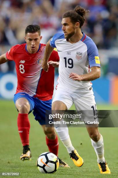 Graham Zusi of the United States challenged by Bryan Oviedo of Costa Rica during the United States Vs Costa Rica CONCACAF International World Cup...