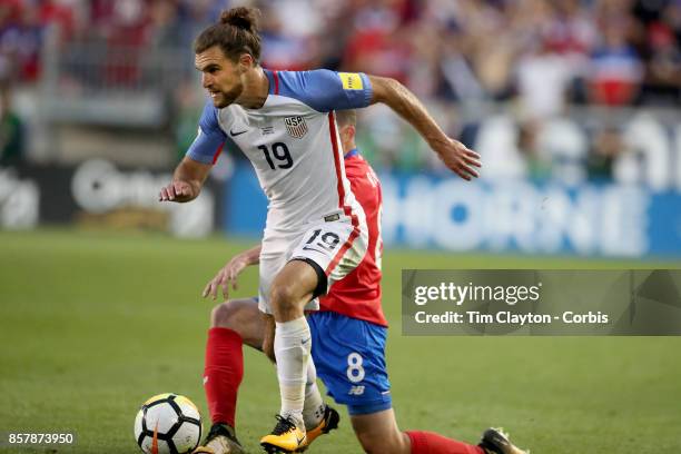 Graham Zusi of the United States challenged by Bryan Oviedo of Costa Rica during the United States Vs Costa Rica CONCACAF International World Cup...