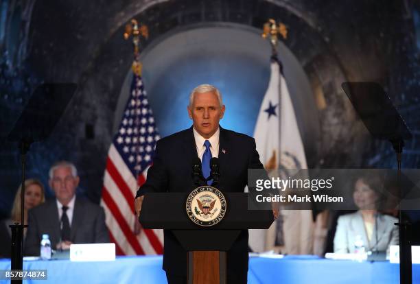 The Space Shuttle Discovery is the back drop as Vice President Mike Pence speaks during the inaugural meeting of the National Space Council on...