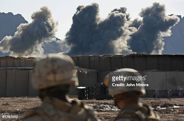 Tons of bombs dropped by a U.S. Air Force B-1 bomber land on Taliban positions on April 3, 2009 in Now Zad in Helmand province, Afghanistan. American...