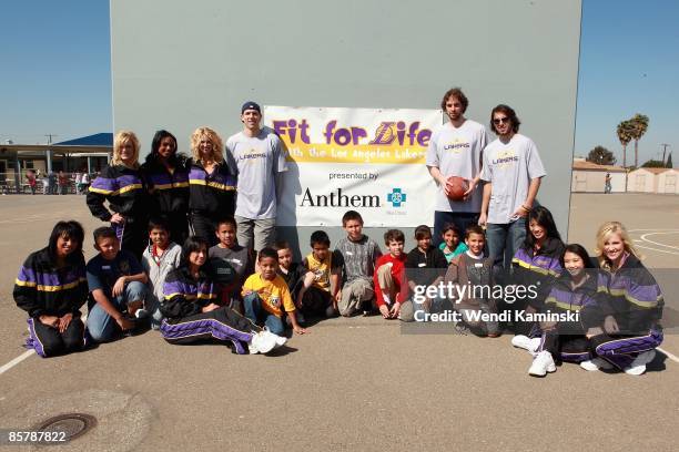 Luke Walton, Pau Gasol and Sasha Vujacic of the Los Angeles Lakers and the Laker Girls poses with students during Anthem Blue Cross's "Fit for Life"...