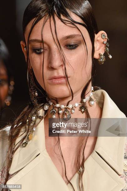 Model, jewelry detail, walks the runway during the Alexander McQueen Paris show as part of the Paris Fashion Week Womenswear Spring/Summer 2018 on...