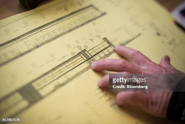 Project manager reviews plans in an office at the Deltaport Logistics Facility construction site in Tsawwassen, British Columbia, Canada, on...