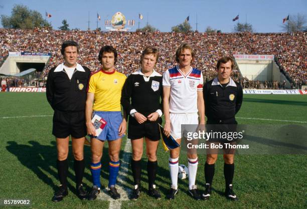 Referee Ulf Eriksson with his linesmen and the team captains, Romania's Costica Stefanescu and England's Phil Thompson prior to their World Cup...