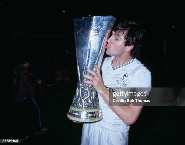 Tottenham Hotspur defender Paul Miller kisses the UEFA Cup after Spurs had beaten Anderlecht 4-3 on penalties in the UEFA Cup Final 2nd Leg at White...