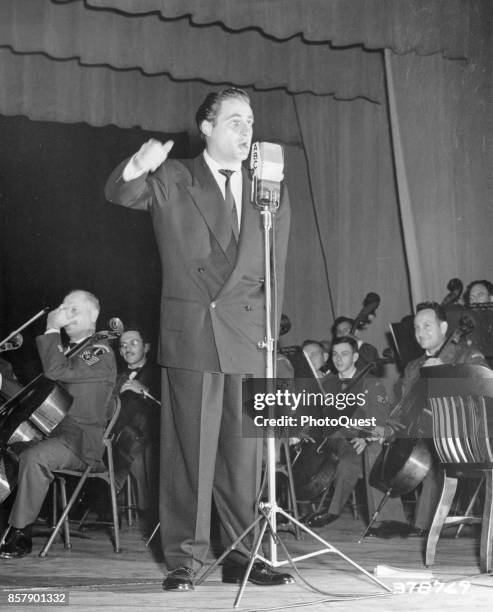 American comedian and actor Sid Caesar performs onstage for ABC television's 'Time for Defense,' a weekly entertainment and documentary show ,...