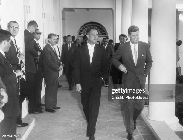 View of American politicians , Director of the Peace Corps Sargent Shriver and President John F Kennedy as they greet the inaugural group of Peace...