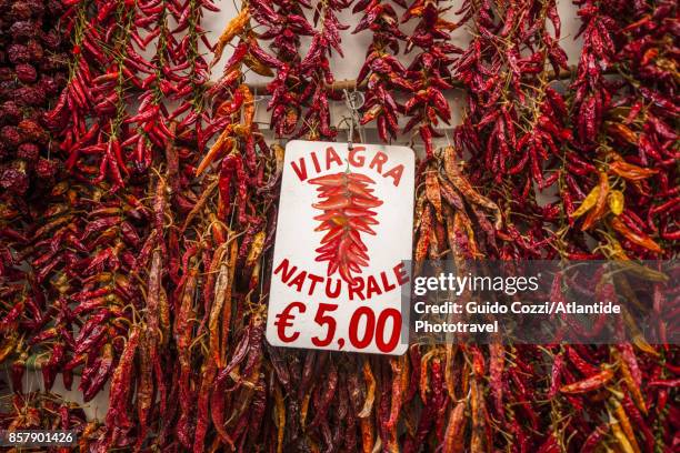 red hot peppers for sale - liebestrank stock-fotos und bilder
