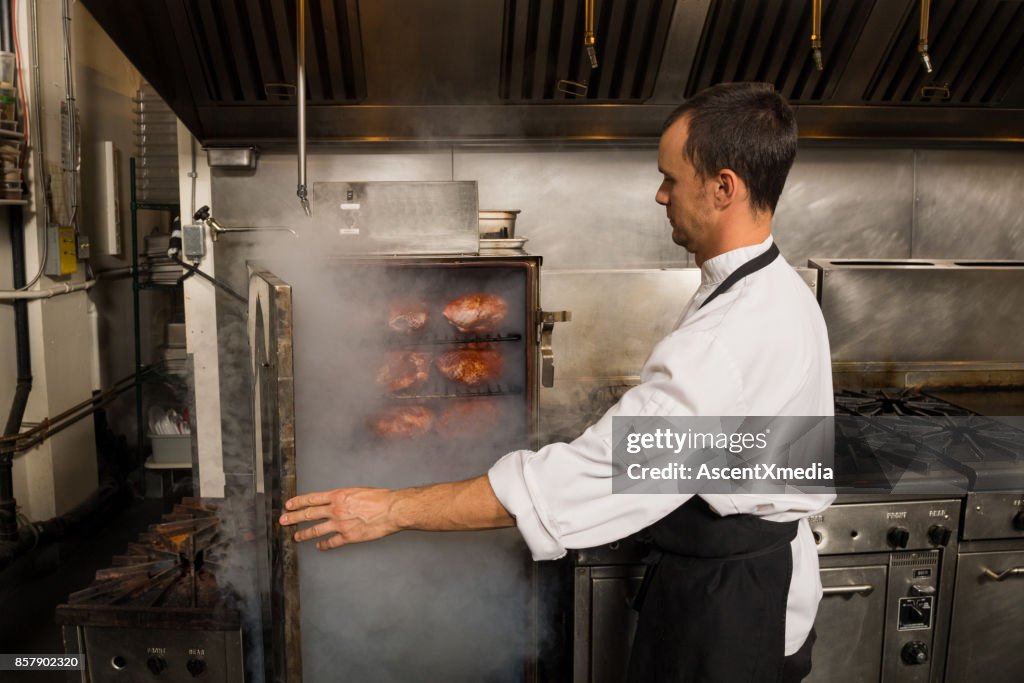 Chef preparing smoked meats