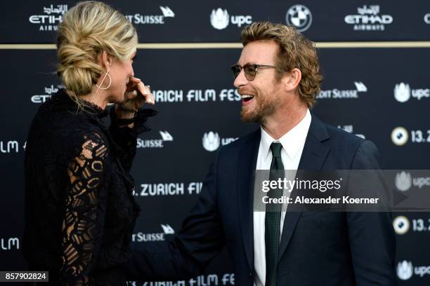 Festival director Nadja Schildknecht and Simon Baker attend the 'Breath' premiere at the 13th Zurich Film Festival on October 5, 2017 in Zurich,...