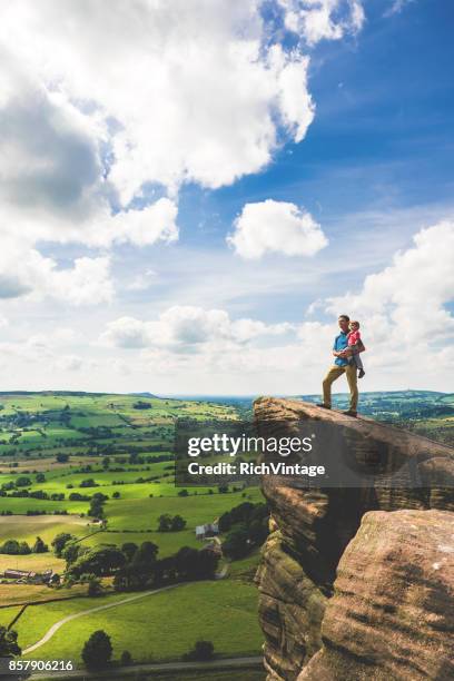 father and son hiking in peak district - peak district stock pictures, royalty-free photos & images