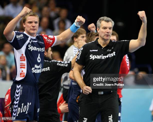Head coach Per Carlen and Oscar Carlen of Flensburg celebrate during the EHF Champions League match between HSV Hamburg and SG Flensburg at the Color...