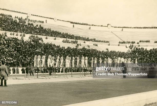 The Pan-Hellenic Gymnastics Association team, captained by Sotirios Athanasopoulos, in action - 32 men in total, all dressed like sailors in...