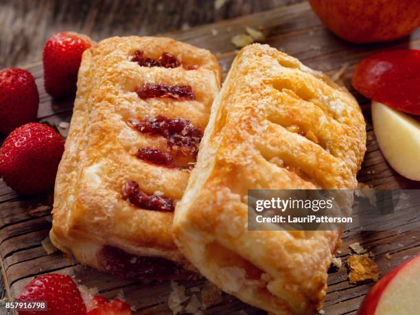 strawberry and apple strudels - strudel stock pictures, royalty-free photos & images