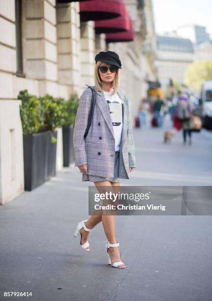 Gitta Banko wearing checked blazer and skirt from Zara, t-shirt by Marina Hoermanseder, white bow-embellished lace leather sandals by Stella Luna,...