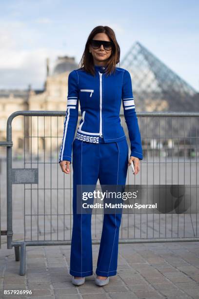 Guest is seen attending Louis Vuitton during Paris Fashion Week wearing Louis Vuitton on October 3, 2017 in Paris, France.