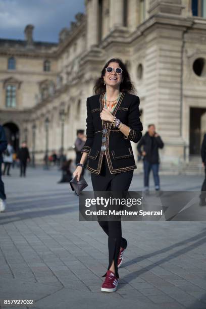 Leandra Medine is seen attending Louis Vuitton during Paris Fashion Week wearing Chanel and Celine on October 3, 2017 in Paris, France.