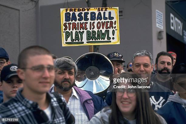 Post MLB Strike: View of fan outside Yankee Stadium with FREDDY SEZ BASEBALL STRIKE IS OVER PLAY BAWL! sign before New York Yankees vs Texas Rangers...