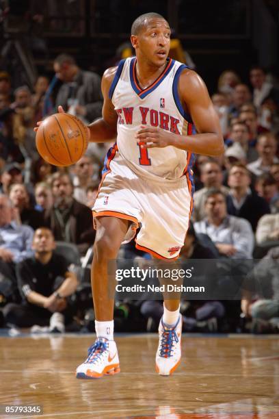 Chris Duhon of the New York Knicks dribbles the ball downcourt against the Sacremento Kings on March 20,2009 at Madison Square Garden in New York...