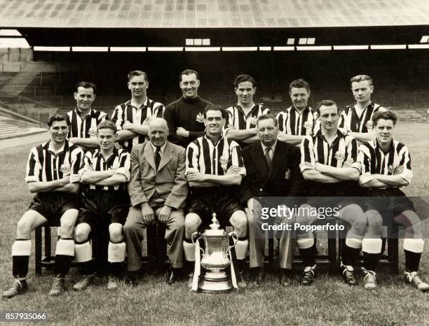 Cup winners, Newcastle United, pictured with the trophy at St James' Park in Newcastle, circa August 1951. Newcastle, who were captained by Joe...