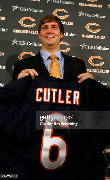 Quarterback Jay Cutler of the Chicago Bears holds up his jersey after he was introduced as their new quarterback during a press conference on April...