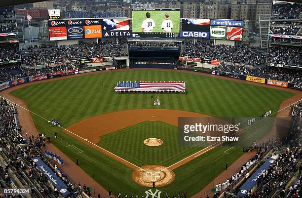 General view of Yankee Stadium during the playing of the National Anthem before the New York Yankees game against the Chicago Cubs at Yankee Stadium...