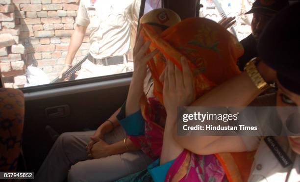 Honeypreet Insan in car while being taken to house in Nayi Basti suspected to be her hideout on October 5, 2017 in Bathinda, India. Honeypreet was...