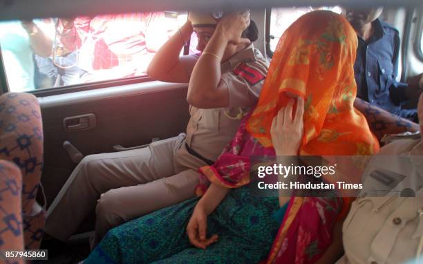 Honeypreet Insan in car while being taken to house in Nayi Basti suspected to be her hideout on October 5, 2017 in Bathinda, India. Honeypreet was...