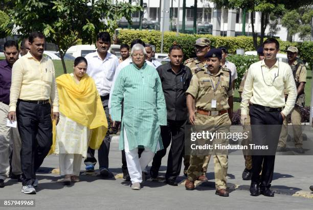 Chief Lalu Yadav and his daughter Misa Bharti at CBI headquarter on October 5, 2017 in New Delhi, India. Bihar politician Lalu Yadav was questioned...