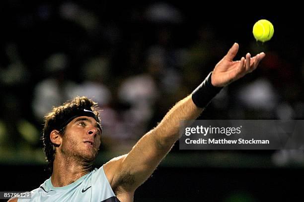 Juan Martin Del Potro of Argentina serves against Andy Murray of Great Britain during the men's semifinal of the Sony Ericsson Open at the Crandon...