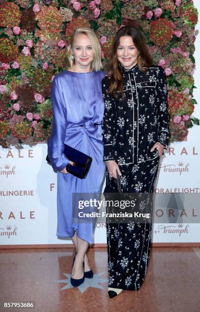 German actresses Anna Maria Muehe and Hannah Herzsprung in Erdem x H&M attend the Florale By Triumph Dinner Hosted By Julianne Moore at Altes...