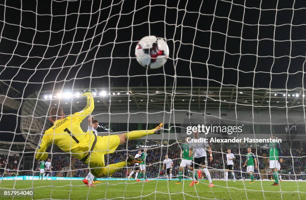 Sebastian Rudy of Germany shoots past Michael McGovern of Northern Ireland to score his goal during the FIFA 2018 World Cup Qualifier between...