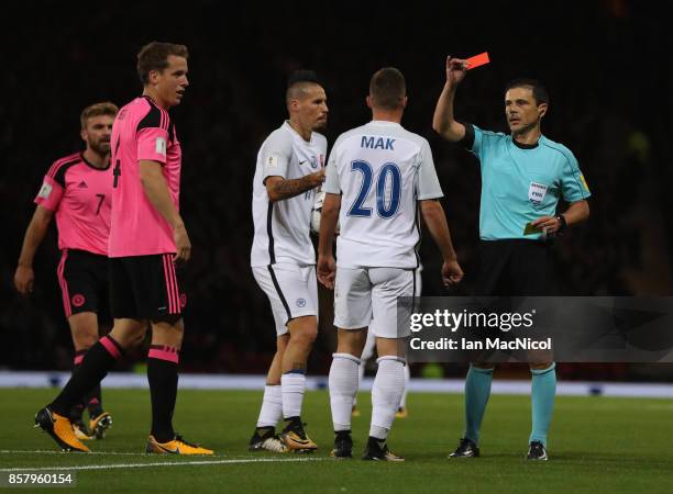 Robert Mak of Slovakia is shown a red card during the FIFA 2018 World Cup Qualifier between Scotland and Slovakia at Hampden Park on October 5, 2017...