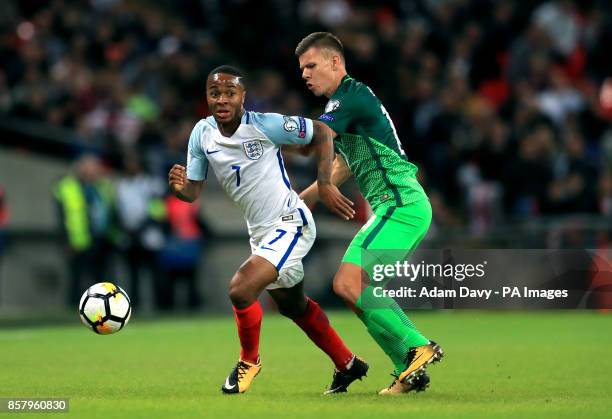 England's Raheem Sterling and Slovenia's Roman Bezjak battle for the ball during the 2018 FIFA World Cup Qualifying, Group F match at Wembley...