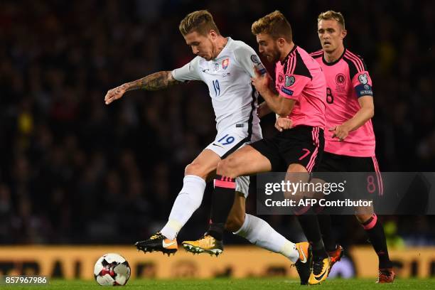 Slovakia's midfielder Juraj Kucka vies with Scotland's midfielder James Morrison during the FIFA World Cup 2018 qualifying football match between...