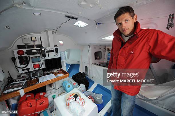 French skipper Erwan Tabarly poses in his monohull "Athema" on April 4, 2009 at Le Palais harbour in Belle-Ile-en-Mer island, western France. He will...