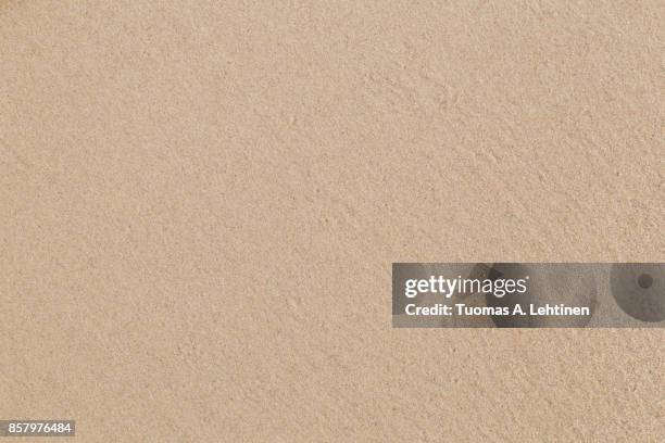 close-up of smooth sand at a beach texture background. - sand fotografías e imágenes de stock