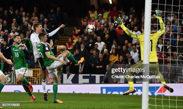 Thomas Muller of Germany sees his shot blocked during the FIFA 2018 World Cup Qualifier between Northern Ireland and Germany at Windsor Park on...